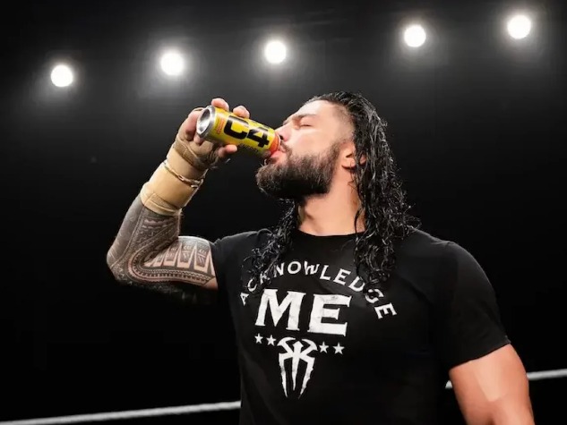 A WWE talent drinking C4 Energy ringside during a C4 campaign